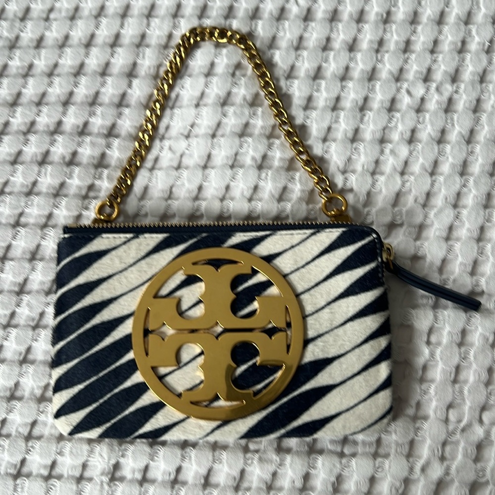 Authentic Tory Burch fun zebra print wristlet/clutch excellent condition.